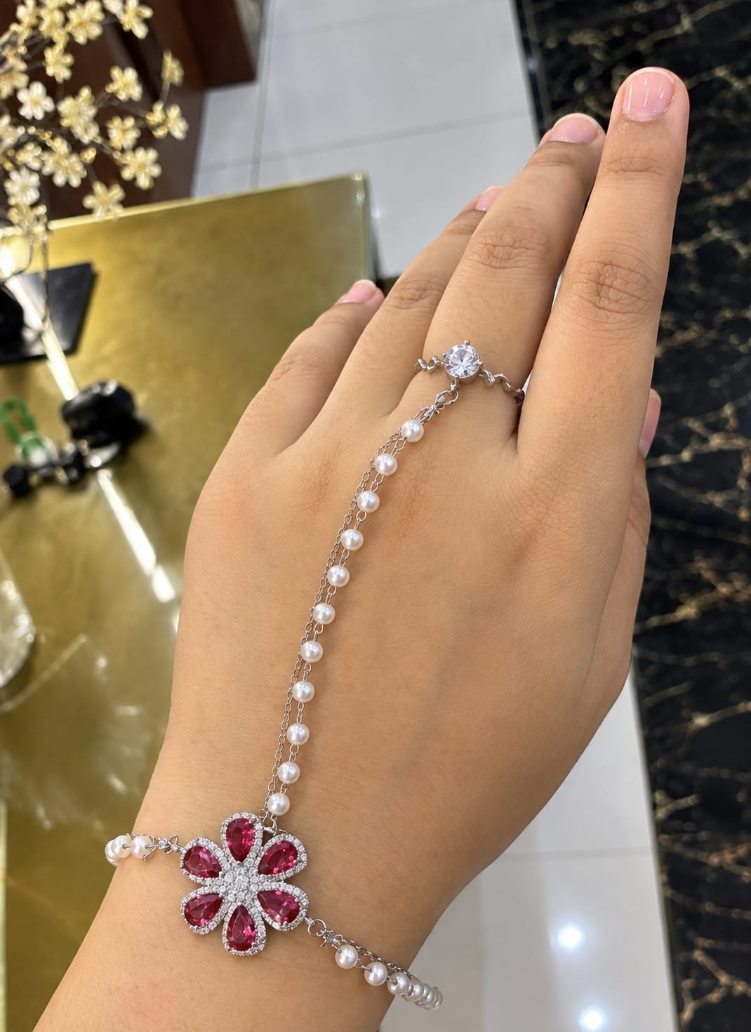Ruby Bloom Pearl Hand Chain